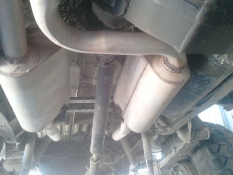 1979 Ford Bronco - Undercarriage view of a 1979 Ford Bronco, highlighting its exhaust system and suspension.