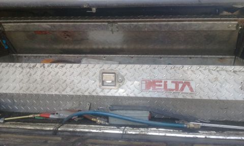 1979 Ford Bronco - A diamond plate toolbox with the Delta logo and various tools is visible.