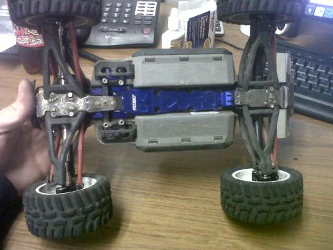 2011 Ford 427 - Remote control car chassis with visible suspension and battery compartments.
