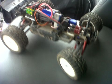 2011 Ford 427 - This is a remote control monster truck with its body removed, showing the internal components.