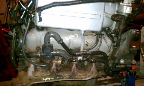 1994 Ford F-250 - Engine part with visible serial numbers, not enough detail to confirm vehicle year or model.