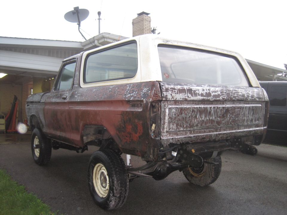 1979 Ford Bronco rear view, weathered red and white body