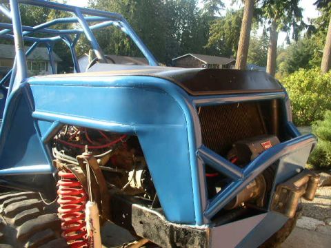 1979 Ford Bronco - This custom-built buggy features a prominent roll cage and a visible winch mounted on the front.