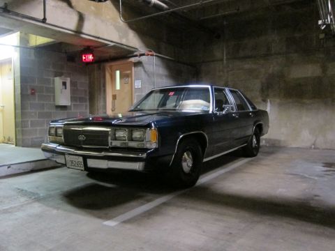 1991 Ford Crown Victoria - This 1991 Ford Crown Victoria sedan is parked in a dimly lit garage.