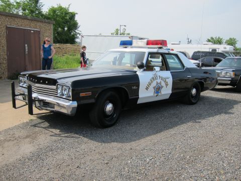 1991 Ford Crown Victoria - This police car features a push bumper and a light bar on the roof.