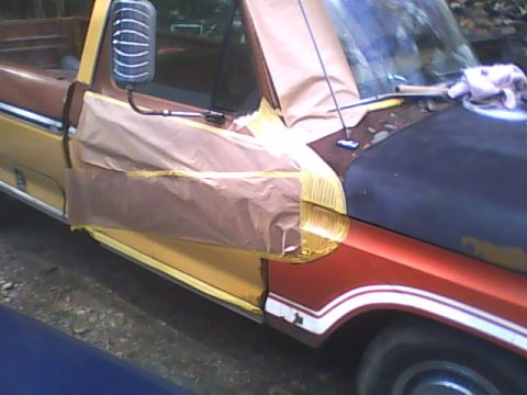 1976 Ford F-150 - This truck is covered in masking tape and paper, likely in preparation for a new paint job.