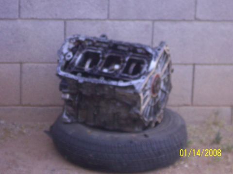 1995 Ford Probe - Engine block resting on a tire with a Supermotors.net watermark visible.