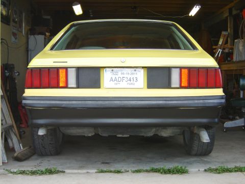 1979 Ford Mustang - Rear view of a yellow 1979 Ford Mustang, showing its taillights and license plate.