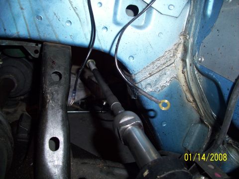 1995 Ford Probe - Close-up view of automotive engine bay components with visible wiring and metal parts.