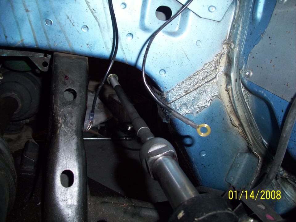 Blue car engine bay with black wires and metal components. Date stamp reads 01/14/2008