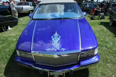 1991 Ford LTD Crown Victoria - A custom 1991 Ford Crown Victoria displays its unique blue paint job and pinstripe detailing from a front-facing perspective.