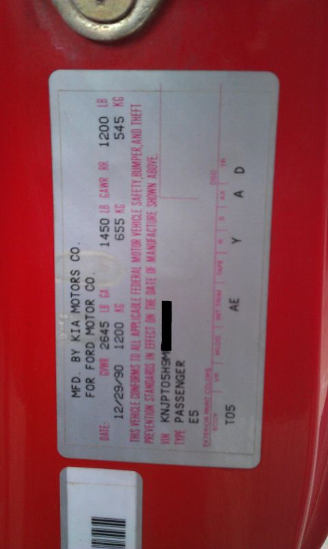 1991 Ford Festiva - This vehicle identification sticker provides manufacturing details and VIN for the car.