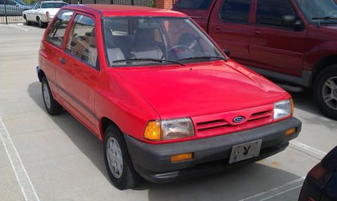 1991 Ford Festiva - This 1991 Ford Festiva is parked in a lot, showing its front 3/4 view.