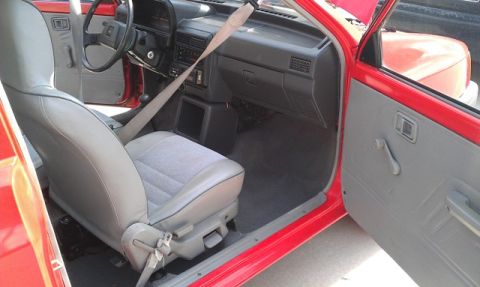 1991 Ford Festiva - Interior view of a 1991 Ford Festiva, highlighting the seats and dashboard.