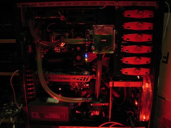Computer internals with red lighting, water cooling, and ATI Radeon graphics card