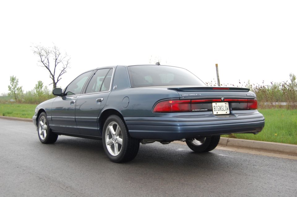 Blue Mercury Grand Marquis with spoiler and custom license plate
