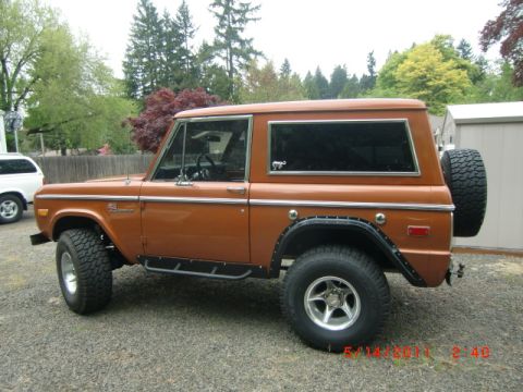 1973 Ford Bronco - This 1973 Ford Bronco is shown from the side, a spare tire mounted on the rear tailgate.