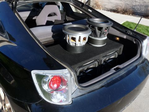 2006 Ford E350 - Aftermarket subwoofers installed in the trunk of a car.