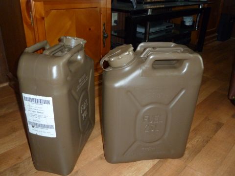 1992 Ford Mustang - Two brown jerrycans are shown, one with a white label containing text and a barcode.