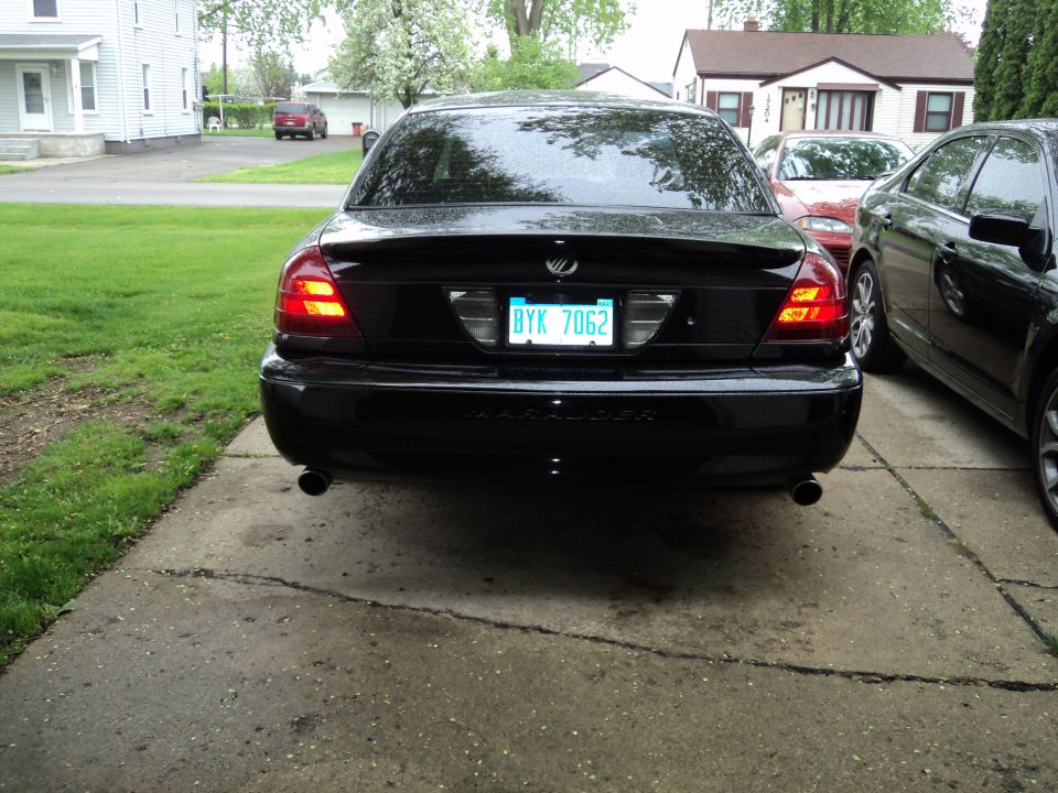 Rear view of a black 2004 Mercury Grand Marquis parked on a driveway