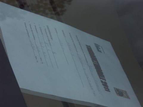 1977 Pontiac Trans Am - A document with handwritten and printed text is viewed through a window, with a watermark at the bottom.
