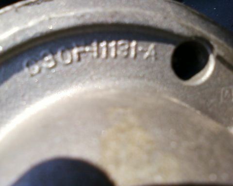 1976 Ford Torino - A close-up view of a metal component shows stamped identification numbers and a website watermark.
