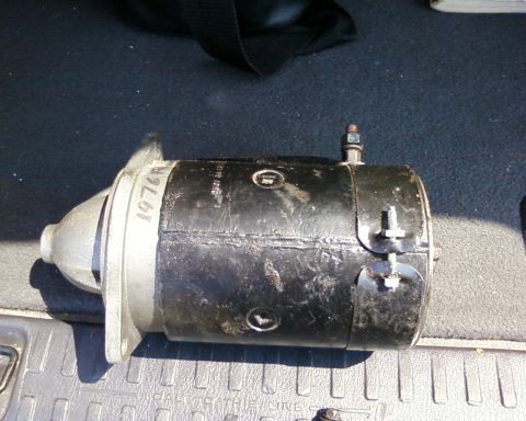1976 Ford Torino - A starter motor is shown with "1976" handwritten on its casing.