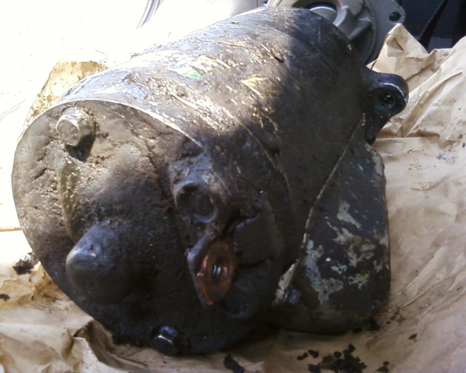 Greasy starter motor, close-up view