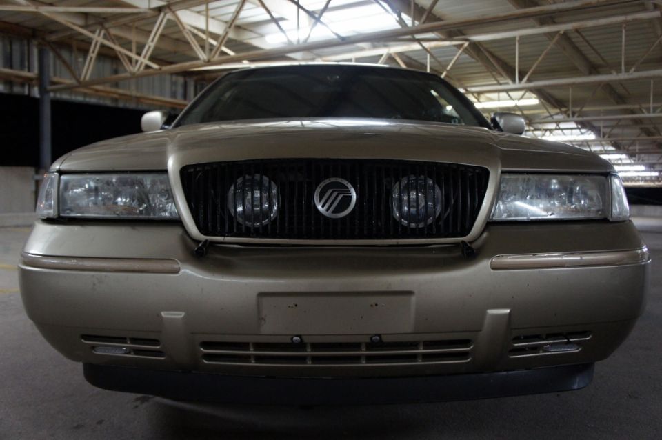 Gold 2000 Mercury Grand Marquis front grille and headlights