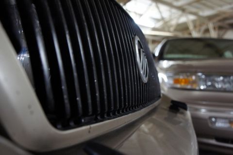 2000 Mercury Grand Marquis - The grille of a 2000 Mercury Grand Marquis is visible in the foreground, with another vehicle behind it.
