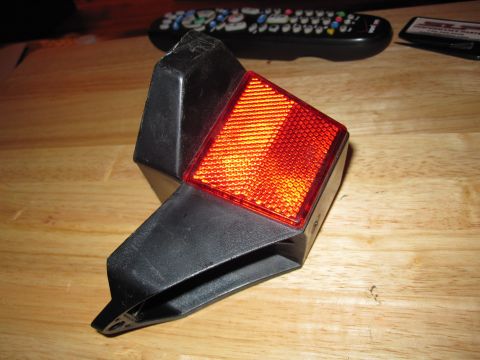 1981 Garelli Rally Sport - This is a motorcycle tail light assembly, likely a replacement part, shown on a table.