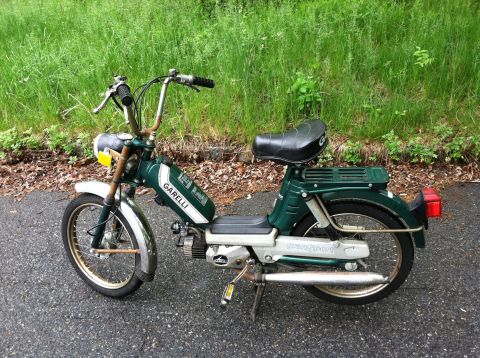 1981 Garelli Rally Sport - A green moped with chrome fenders and "GARELLI" branding on the fuel tank is parked on asphalt.