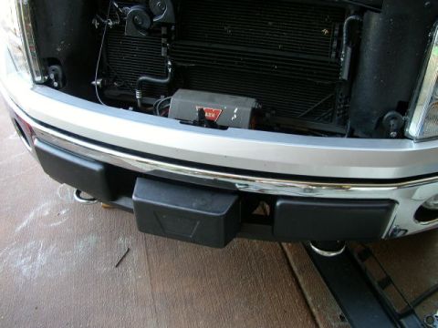 1995 Ford Bronco - Close-up of a truck's front end, revealing the grille, bumper, and a WARN winch installed.