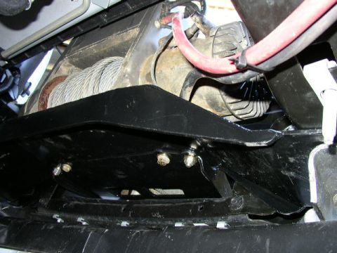 1995 Ford Bronco - Underside view of a vehicle's winch and mounting hardware.