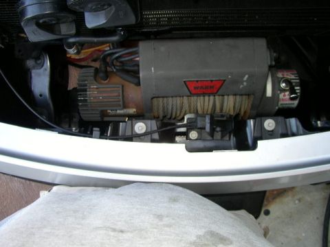 1995 Ford Bronco - A WARN winch is visible, mounted beneath the front bumper of a vehicle.