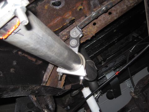 1979 Ford Bronco - Close-up view of an exhaust pipe and rusted frame components, with a "Supermotors.net" watermark visible.