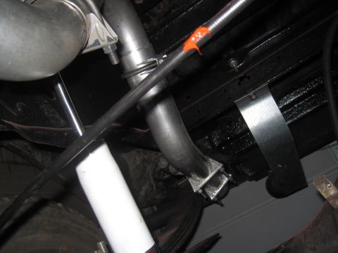 1979 Ford Bronco - Underside view shows exhaust system components and suspension parts.