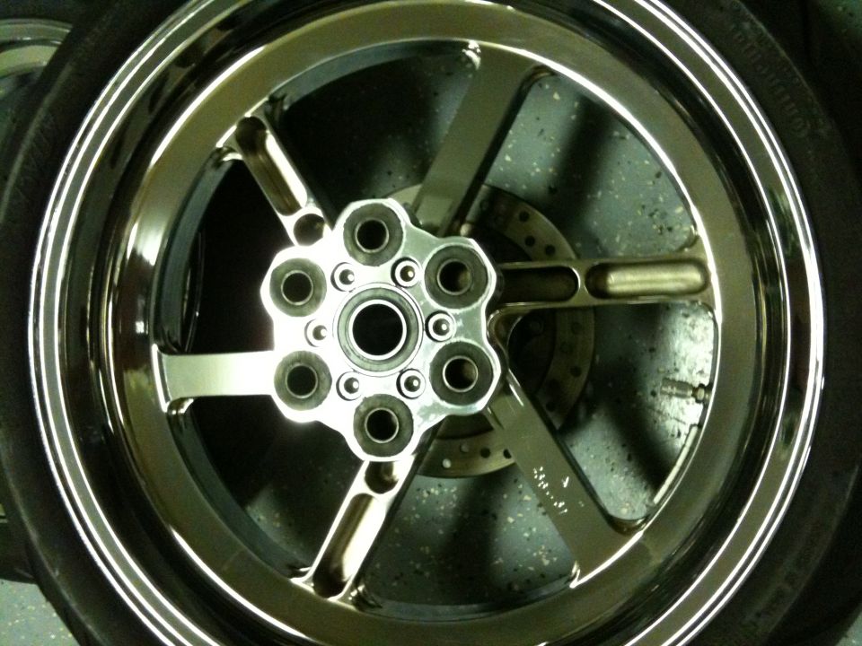 Chrome motorcycle wheel with six-bolt hub and disc brake