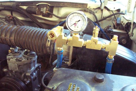 1996 Ford Bronco - The manifold with QD, Gauge, 150 PSI Safety Valve, a Plug where the Pressure Switch will be, Inlet from Compressor, and Output to the Tank…