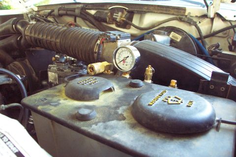 1996 Ford Bronco - Installed to back side of fluid reservoir bracket the manifold is nicely tucked away, yet very accessible. (10/1/2003)