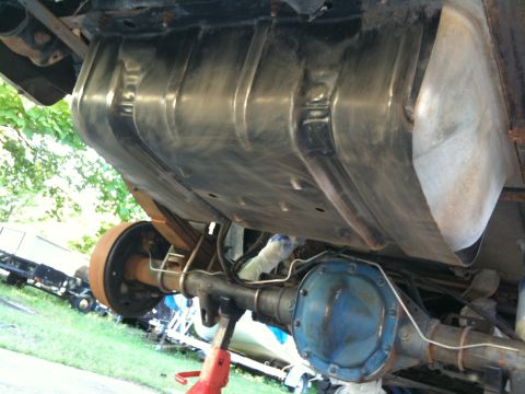 1996 Ford Bronco - Undercarriage view of a 1996 Ford Bronco, highlighting the fuel tank and rear axle assembly.
