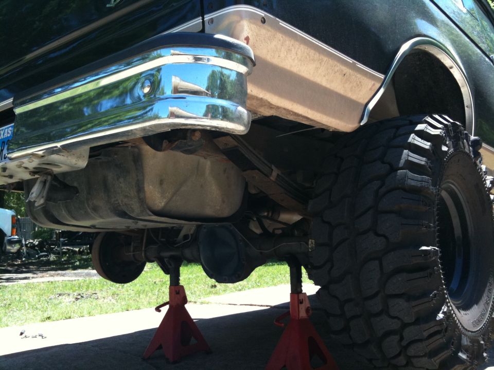 1996 Ford Bronco rear bumper and tire on jack stands