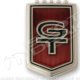 2007 Ford Mustang - Close-up of a GT emblem, likely a car badge.