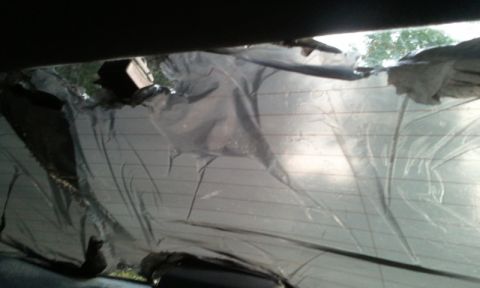 1998 Ford Crown Victoria - sprayed the bag with windex with ammonia and placed the sprayed side on the rear window with the rear defroster on and the heat waited abou…