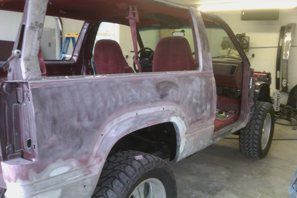 Maroon 1994 Chevrolet Blazer with bodywork, showing interior and rear quarter panel