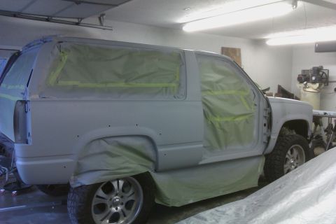 1994 Chevrolet Blazer - This SUV is undergoing preparation for a paint job, with all windows and body panels covered.