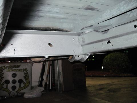 1979 Ford Bronco - The undercarriage of a vehicle is shown, with the frame and some components visible.