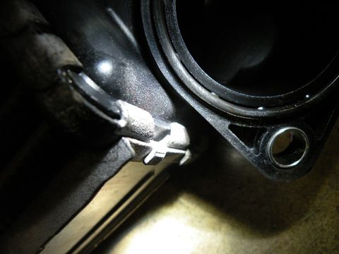 2006 Subaru Legacy - Close-up view of a vehicle's intercooler pipe connection, showing a metal clip mechanism.