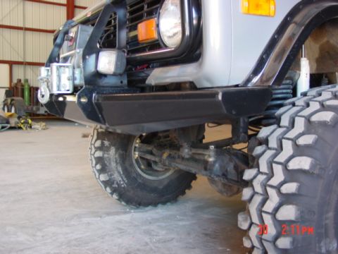 1978 Ford Bronco - The front end of a 1978 Ford Bronco is shown with a winch and aftermarket bumper.