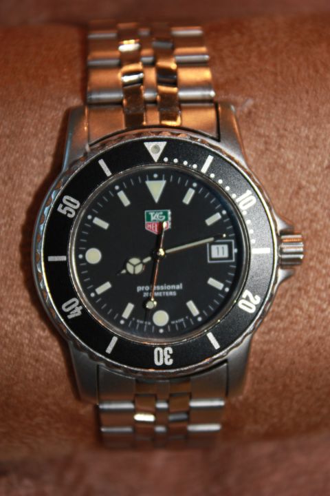 1986 Ford Bronco - This TAG Heuer Professional watch features a black dial with luminous markers and a rotating bezel, indicating 200 meters of water resistan…
